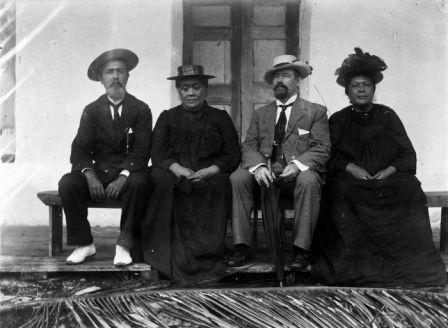 Minister Mills with three Ariki of Rarotonga. (From left) Pa Ariki, Makea Takau Ariki and Tinomana Ariki. This photo was taken on the palace verandah at Taputapuatea.